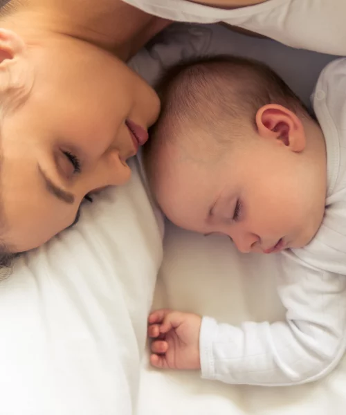 Postpartum Overwhelm mama sleeping with baby